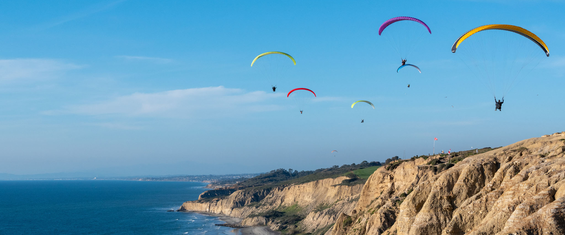 paragliders on the coast